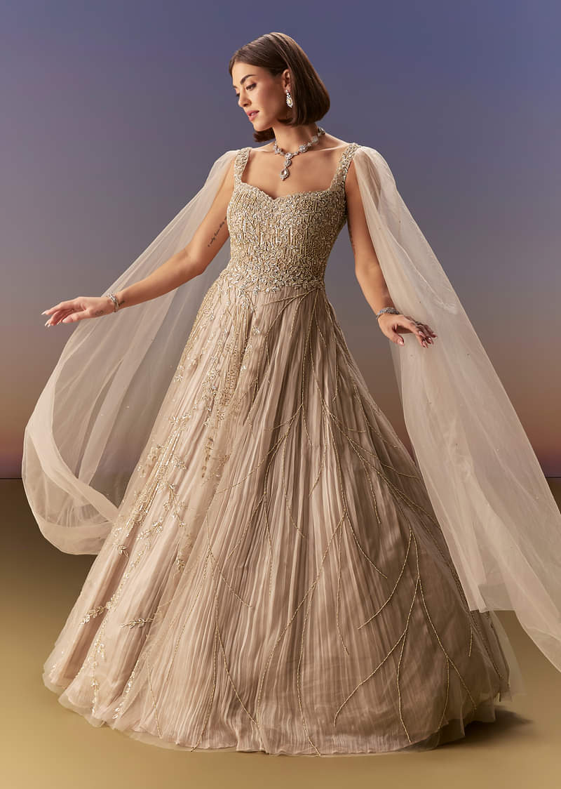 Buy Gold Gown With Pleated Panels And Dramatic Cape