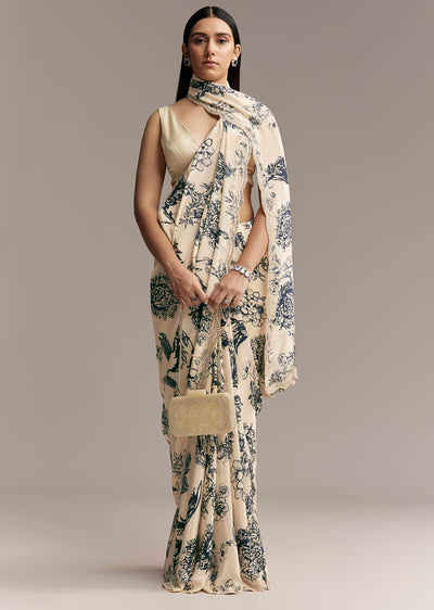 off-white-crepe-saree-with-black-floral-print-and-embroidered-border-sg328006-1