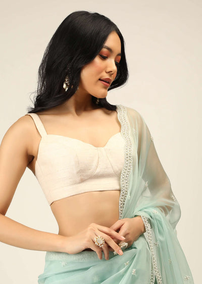 off white sleeveless blouse in raw silk with corset neckline and straps on the shoulder online - kalki fashion 3