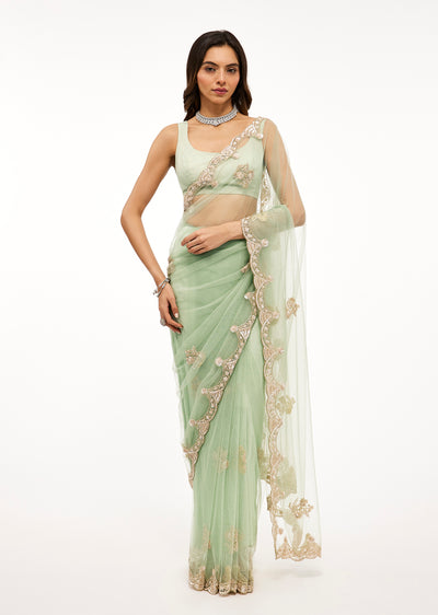 Light Sea Green Net Saree With Deep Scallop Border And Cutdana Sequin Bead Embroidery