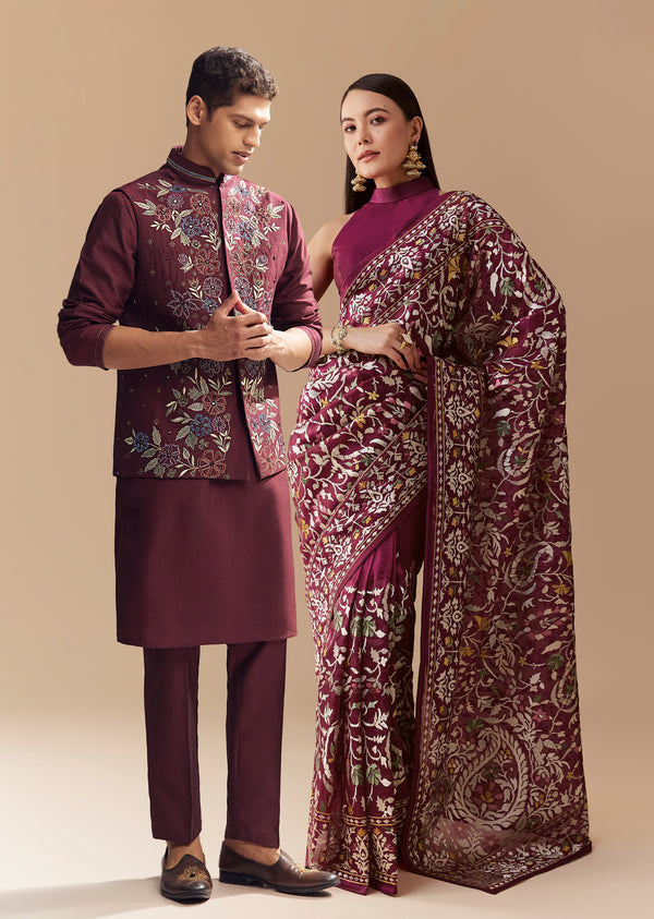 Festive Couple Set – Wine Tissue Organza Embroidered Saree For Her And Red Silk Kurta Jacket Set With Resham Embroidery For Him