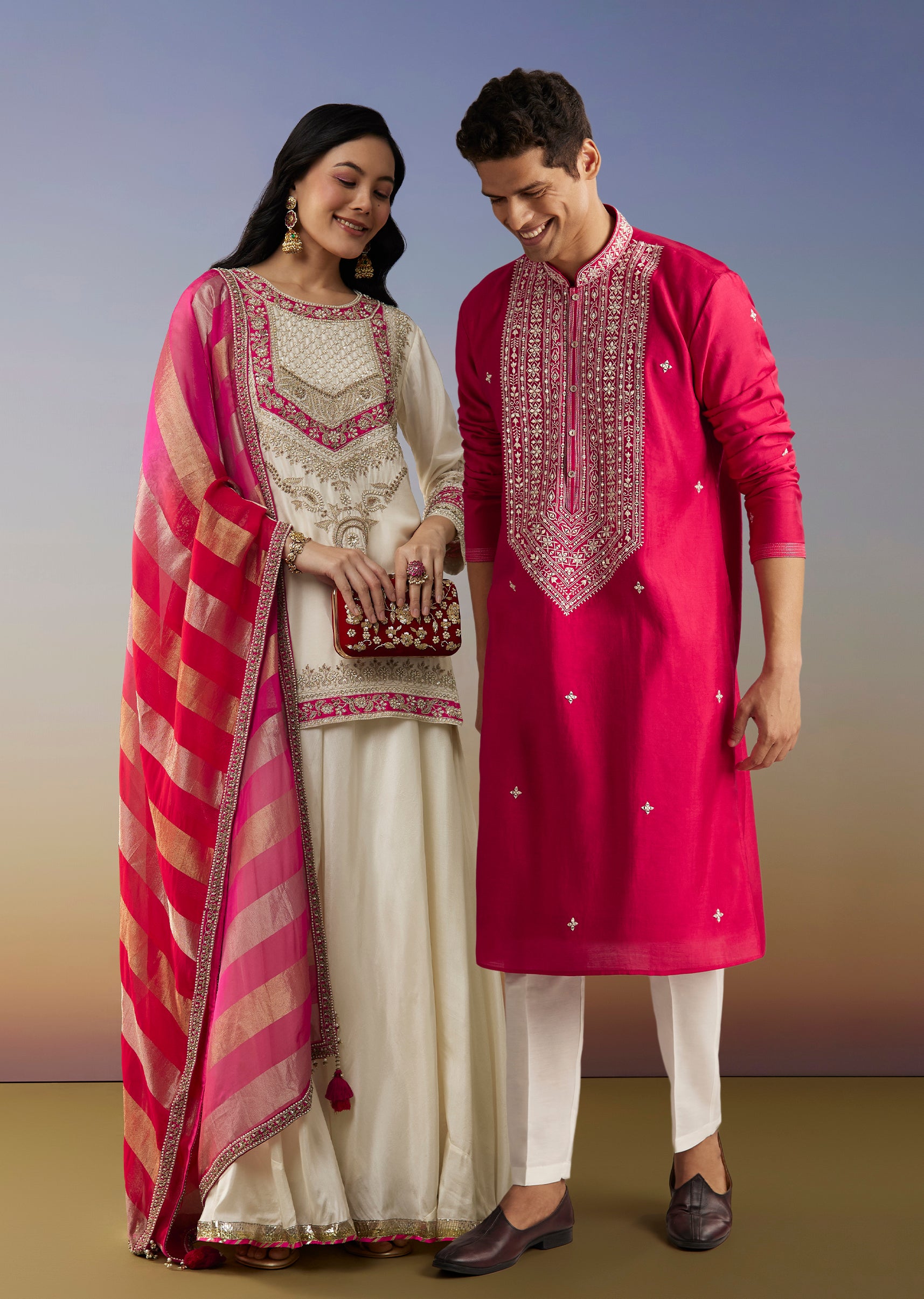 Classic Festive Couple Set – White Silk Palazzo Suit With Moti Zardosi Work For Her And Pink Silk Kurta Set With Mirror And Thread Work For Him