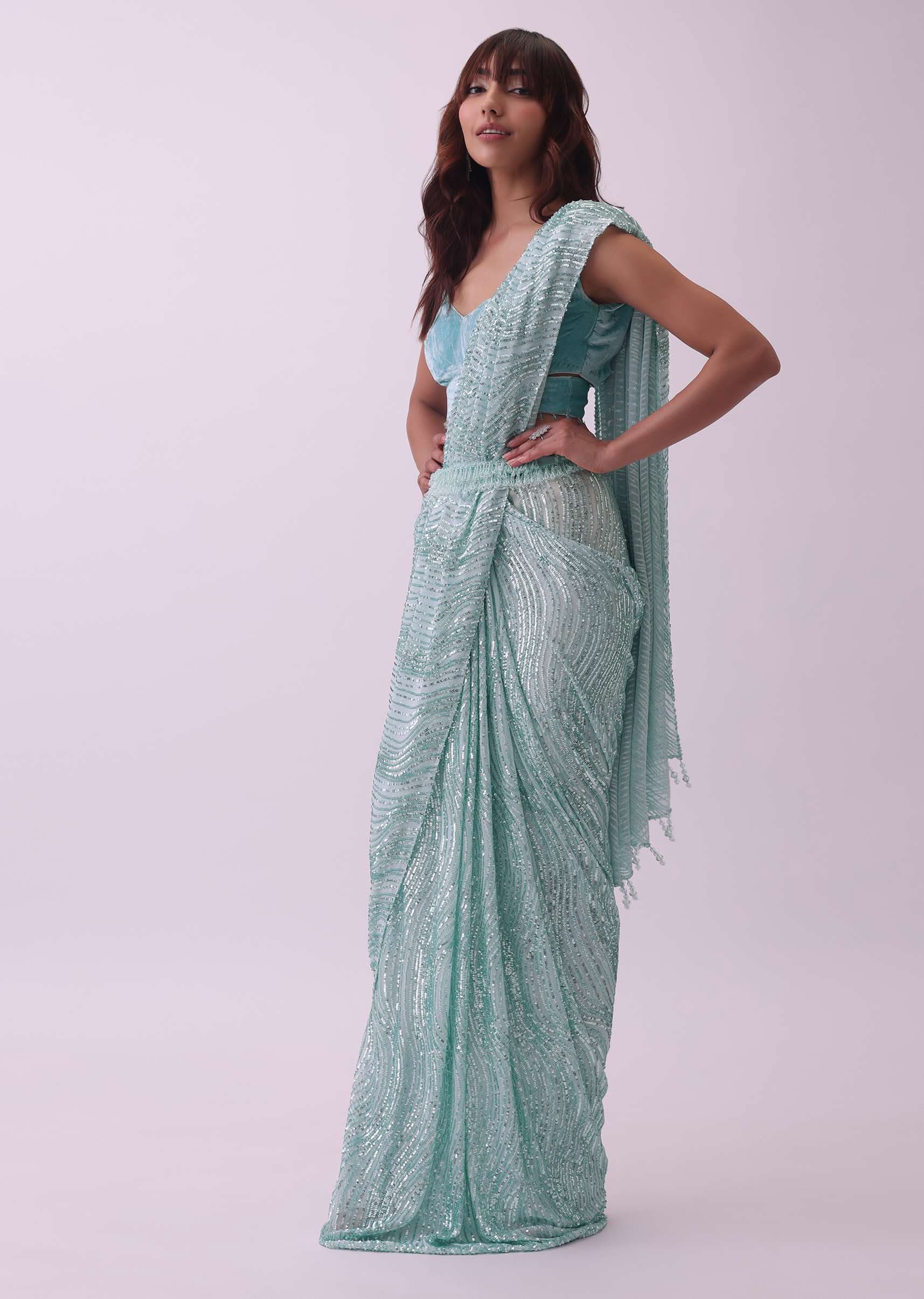 Aqua Blue Saree And Stitched Velvet Blouse With Hanging Crystals