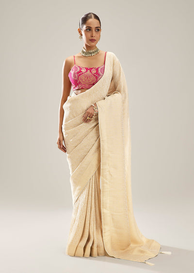 Cream Brocade Tissue Saree And Tassel Pallu