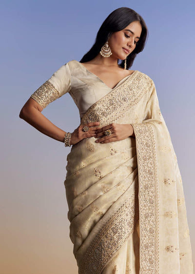 cream-jacquard-silk-saree-with-zari-brocade-and-zardosi-embellished-pallu-sg177295-1 1