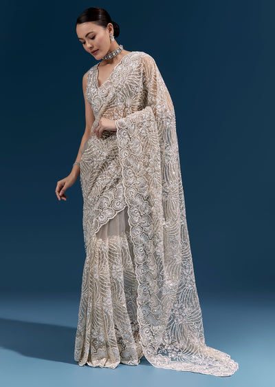 Dusky Beige Heavy Embroidered Net Saree With Cutwork Border And Floral Jaal