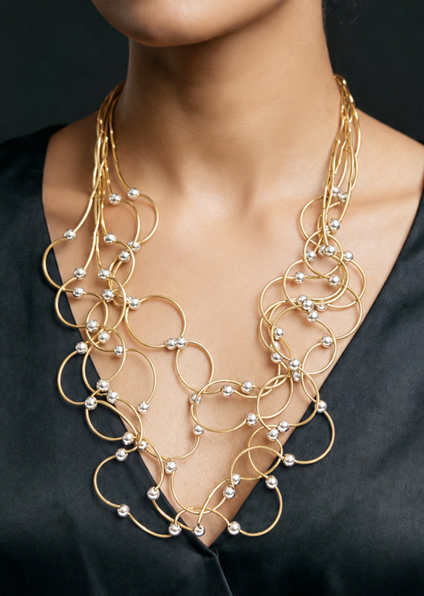 Gold Toned Multi Loop Statement Necklace With Pearl Accents