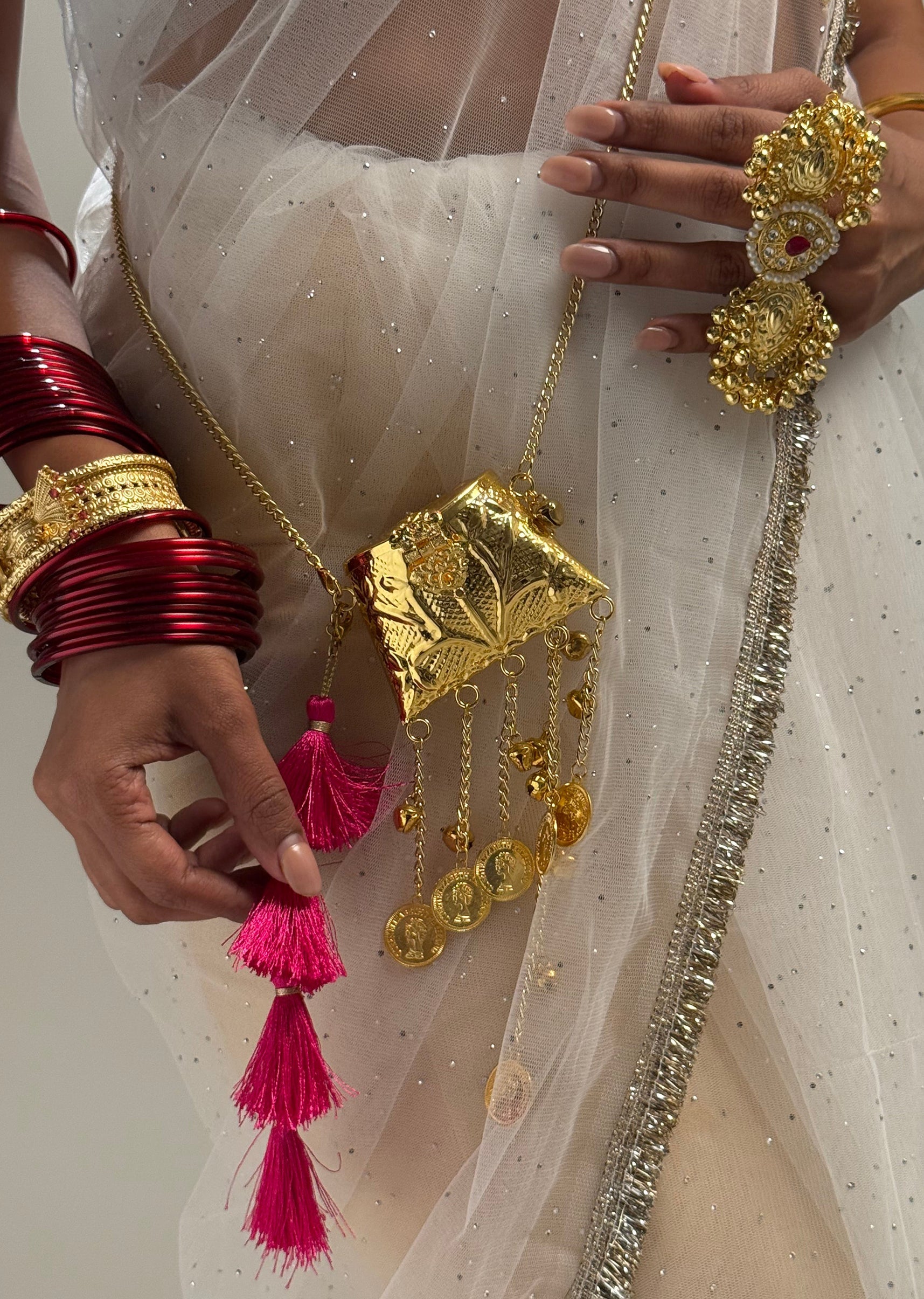 mini-gold-potli-sling-bag-sg388485-1 7cf44b4d-7712-4b66-b8c8-25f53761b1fb