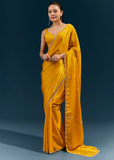 mustard-yellow-satin-saree-with-scalloped-embroidered-border-and-butti-sg385104-1 1e263bbb-faee-4b81-a6bd-b67c5b5229b3