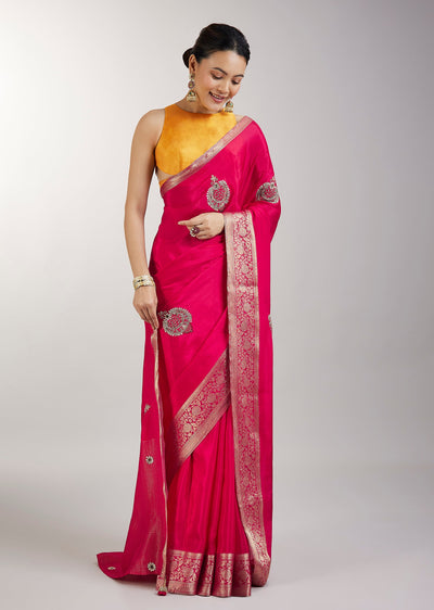 Rani Pink Crepe Saree With Embroidered Butti And Zari Border