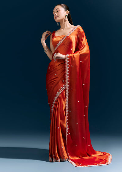 rust-orange-satin-chinon-saree-with-hand-embroidered-border-and-sparkling-buttis-sg385086-1 5d8214fa-b445-463e-91bb-e28ab3d9fd27