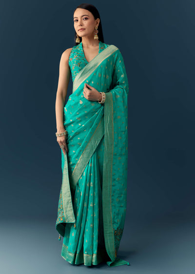 sea-blue-dola-silk-saree-with-woven-border-and-unstitched-blouse-sg350716-1