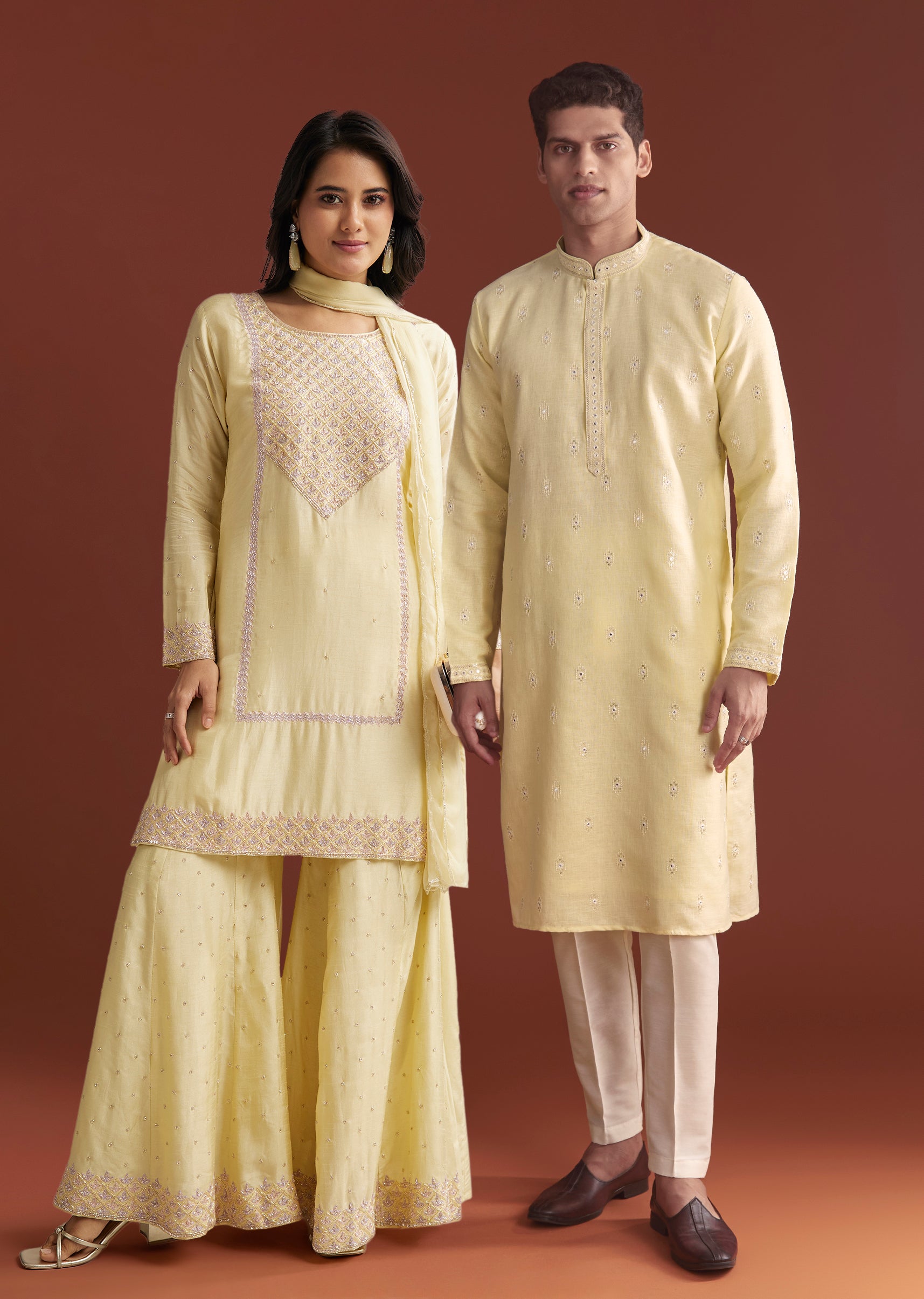 Pastel Yellow Celebration Edit – Embroidered Sharara Set For Her And Pastel Yellow Silk Mirror Work Kurta Set For Him