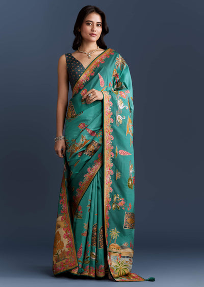 teal-blue-dola-silk-saree-with-nature-motifs-and-embroidery-sg349810-1