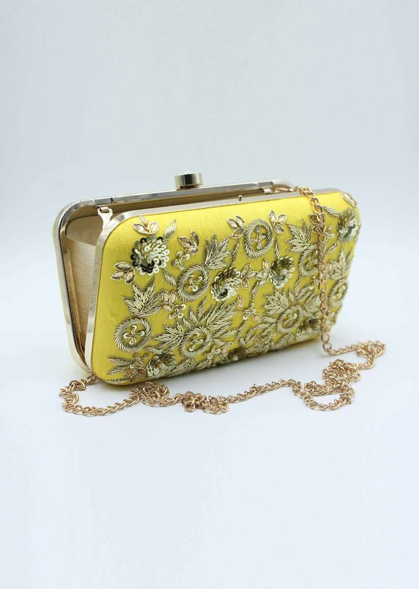 Yellow sling clutch bag embellished in zardosi floral embroidery 